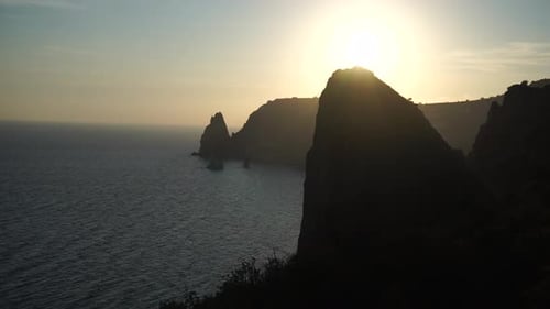 Sea Landscape with Rocky Coastline on Sunset Time