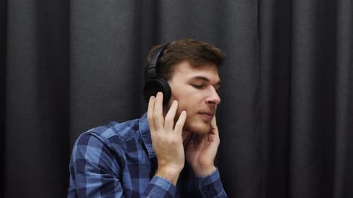 Man Listening to Music and Singing Along