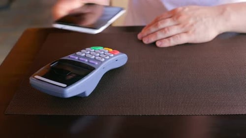 The Businessman Pays a Deal with Nfc System Without Contact in the Office Using a Smartphone