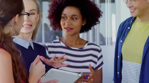 Coworkers Discussing Business in Modern Office