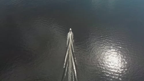 A Man Riding Motor Boat on River