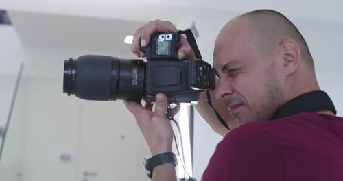 Profesional Photographer in Bright Studio During Photo Session