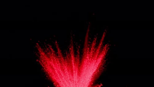 Rotes Pulver explodiert auf schwarzem Hintergrund in Superzeitlupe, aufgenommen mit Phantom Flex 4K