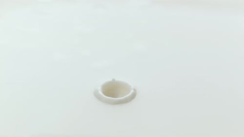 Milk pouring and splashing in slow motion; shot on Phantom Flex 4K at 1000 fps