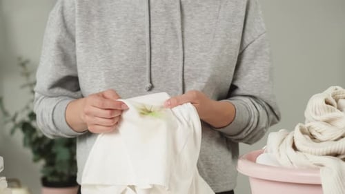 Woman Hands Rubbing Grass Stain on White Clothes Dirty Towel Trying to Wash By Hands Housewife