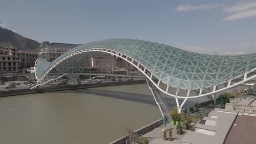 Tbilisi, Georgia - April 2 2021: Aerial view of Tbilisi city central park and Bridge of Peace.