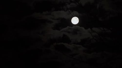 Spooky Full Moon and Clouds in Night Sky
