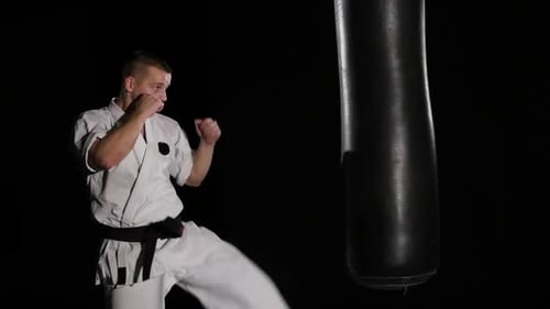 Man Practicing Karate and Kickboxing at Night