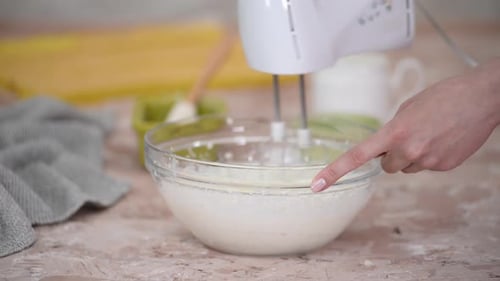 Young Housewife Mixing Whipped Cream