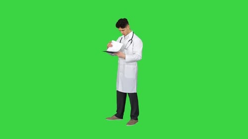 Angry Male Doctor Looking at Documents on a Green Screen, Chroma Key.