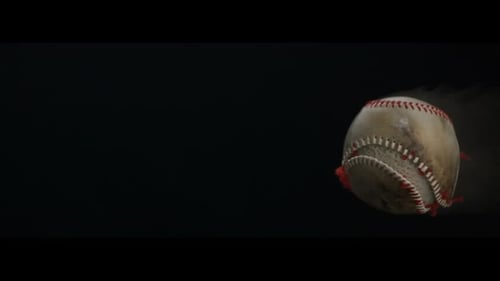 Old Baseball Floating Against Black Background with Smoke