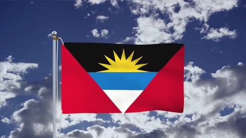 Waving Flag of Antigua and Barbuda with Cloudy Blue Sky