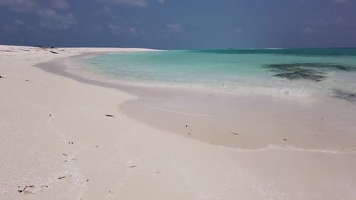 Aerial above seascape of paradise tourist beach holiday by shallow ocean and white sandy background