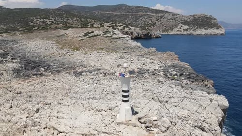 Lighthouse At Edge Of Coast