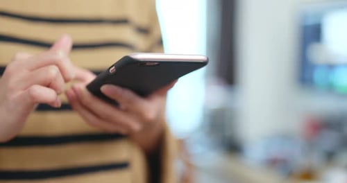 Adult Using Cell Phone in Home, Close Up