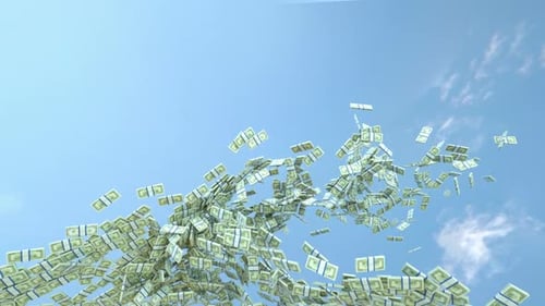 Stacks of Money Flying Against Blue Sky Background