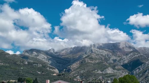 Green Mountains and Moving Clouds on a Sunny Day