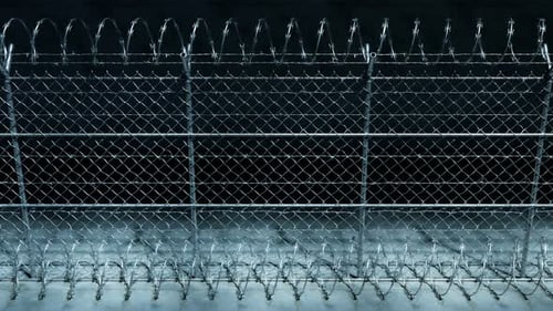 Endless footage showing the whole prison fence at night. Jail protection. 4k HD