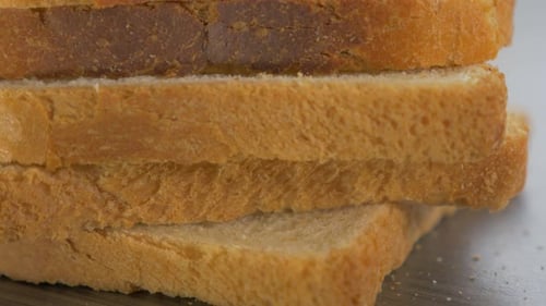 Stack of Sliced Toasted White Bread Close Up