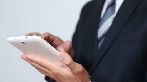 Business Man Using Tablet Device in Office