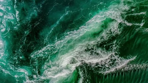 Waves of Water of the River and the Sea Meet Each Other During High Tide and Low Tide