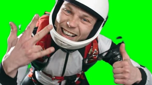 Man in Skydiving Suit Giving Thumbs Up on Greenscreen