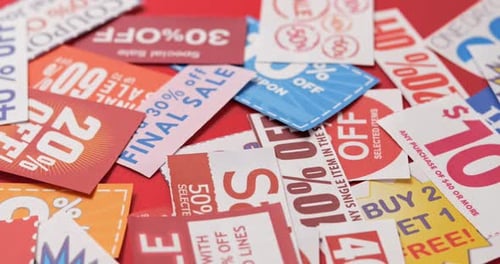 Close Up of Retail Discount Coupons on Red