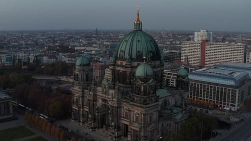 AERIAL: Circling Berlin Cathedral Beautiful Old Structure in Vibrant Fall Colors with Golden Cross