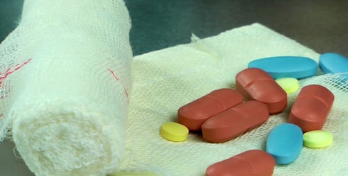 Close Up of Bandage with Colorful Pills