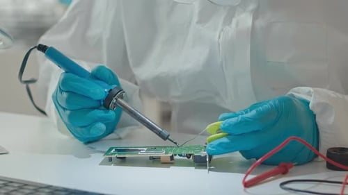 Electronics Repair Technician Soldering Circuit Board