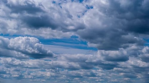 Timelapse of Layered Cumulus Clouds Moving in the Blue Sky