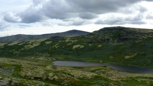 Scenic View From Above of Mountain Range and Lake in Norway