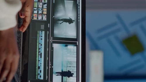 African Videographer Working at Laptop From Office Editing Video Project