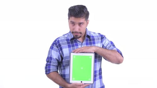 Young Adult Showing Tablet with Green Screen