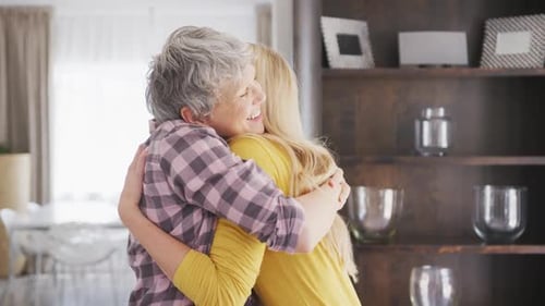 Senior Woman and Young Woman Share a Hug