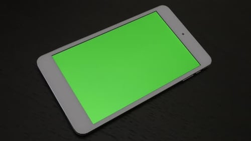 Green screen tablet display wooden surface slow pan 4K 3840X2160 UHD video - Silver white modern gr