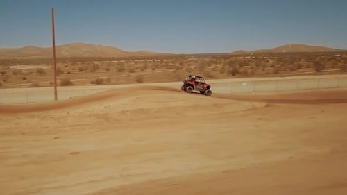 Slowmo off road racing in California City scenic desert, Tracking Shot