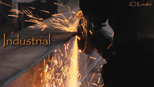 Sparks Fly from Grinder Cutting Metal Beam