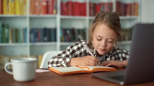 Closeup of Happy Primary Child School Girl Studying Online at Virtual Class with Teacher Tutor By