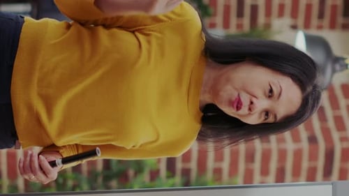 Businesswoman Presenting Data on Whiteboard in Office