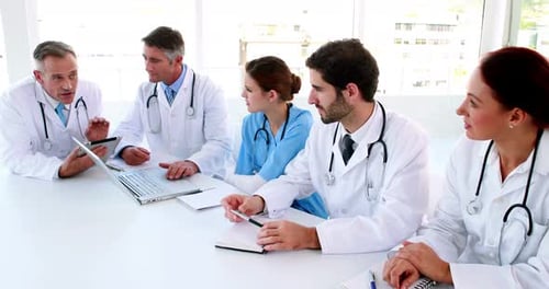 Medical Professionals Meeting at White Conference Table