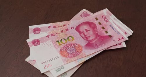 Counting 100 Chinese Yuan Renminbi Banknotes