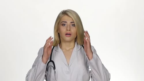 Female Doctor Reacts Bad News in Studio Setting
