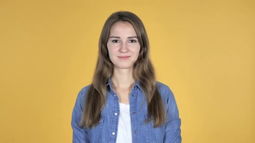Young Woman Smiling in a Studio Setting