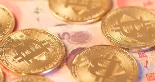 Shiny Gold Bitcoin on Chinese Yuan Banknote