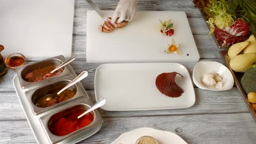 Chef Preparing Food Ingredients on Workbench
