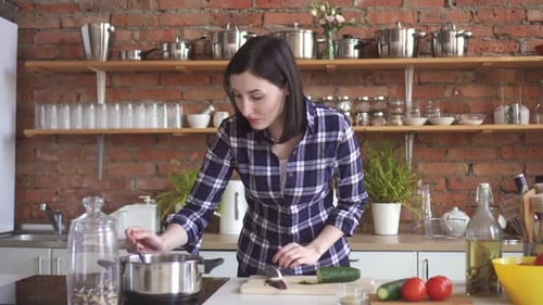 Woman Prepares Food in Bright Kitchen