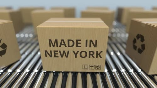 Boxes with MADE IN NEW YORK Text on Roller Conveyor