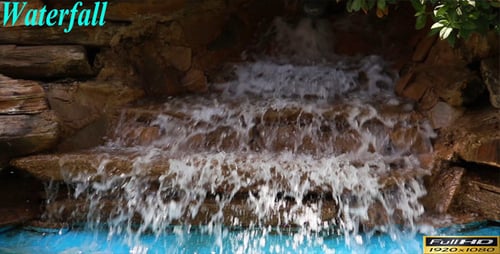 Picturesque Waterfall Cascading into Refreshing Blue Pond