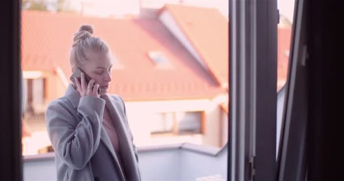 Woman Talking on Mobile Phone with Friend During Pandemic Covid-19 Coronavirus